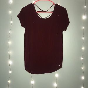 red tee shirt with cross over strap back